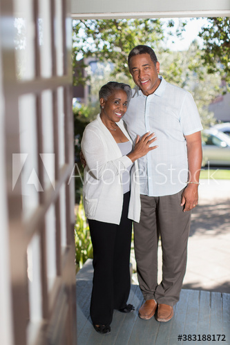 Portrait smiling senior couple on porch