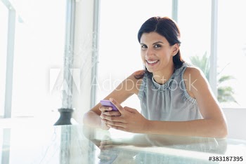 Portrait smiling woman using smart phone