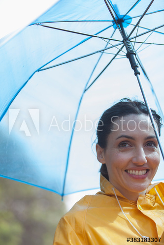 Portrait smiling woman with umbrella