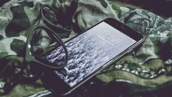 post-2016 iPhone and black framed eyeglasses