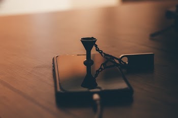 Post-2017 Space Gray Iphone on Brown Wooden Table Close-up Photo