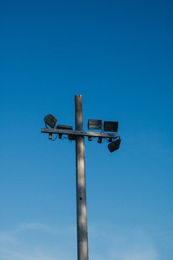 Post With Lights Under Clear Blue Sky