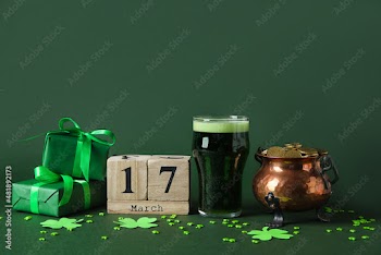 Pot with coins, glass of beer, calendar and gift boxes on green background. St. Patrick's Day celebration