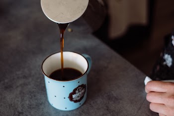 Pouring coffee from a percolator