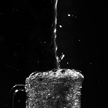 Pouring of Water in Black and White Photo