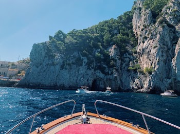 Powerboat in Ocean Near Mountain