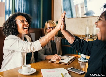 Powerful businesswomen high five