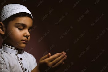 Praying muslim boy
