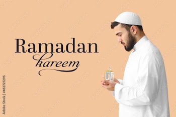 Praying Muslim man with lamp on color background. Ramadan celebration