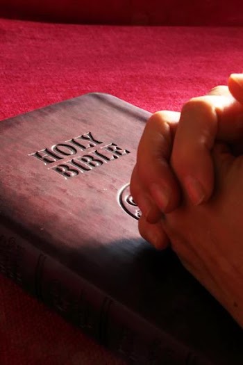 praying_on_bible_red.JPG