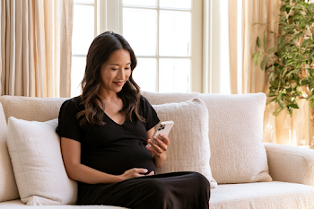Pregnant Asian Woman in Telehealth Consultation