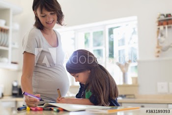 Pregnant mother and daughter coloring