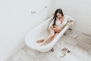 Pregnant Woman Lying on Bathtub