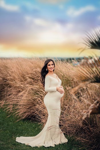 Pregnant Woman Wearing White Long Dress Standing in Wheat Field