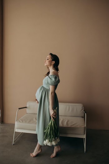 Pregnant Woman with Flowers · Free Stock Photo