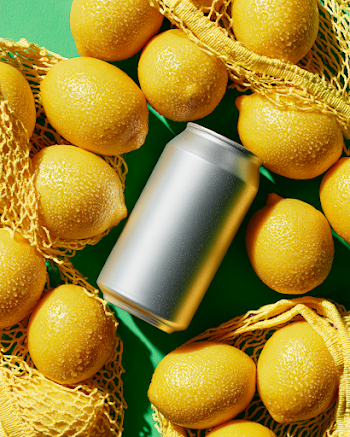 Premium Aluminum Soda Can Mockup with Fresh Lemons