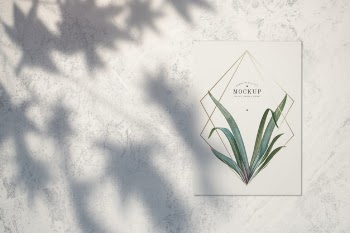 Premium quality card mockup with leaves and golden frames Free Psd