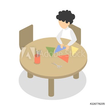 Preschool child sitting and cut the paper
