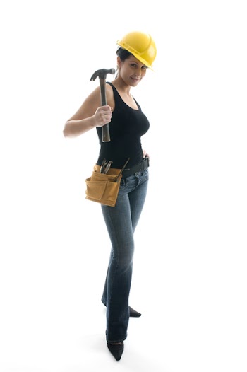 pretty sexy young woman construction worker contractor with tools and hard hat