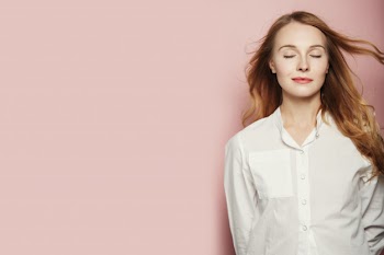Pretty young woman posing on pink background Free Photo