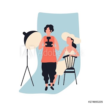 Professional female photographer holding photo camera and model at photographic studio full of photography equipment