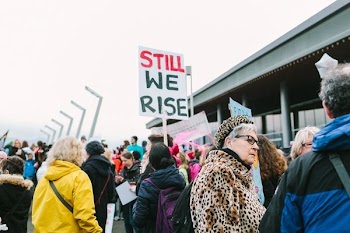 protesters gathered near building at daytime