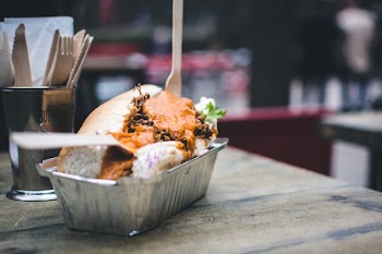 Pulled pork sandwich with cheese sauce 