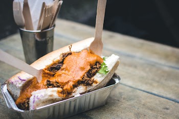 Pulled pork sandwich with cheese sauce 