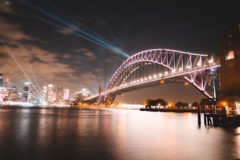 Purple Concrete Bridge Across Body of Water