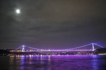 Purple Light on Bride Across Body of Water