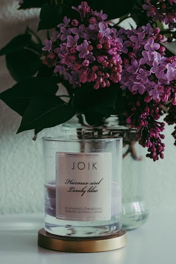 Purple Petaled Flowers On A Glass Jar