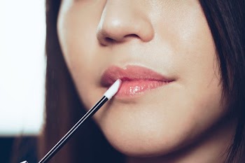 Putting On Lipgloss