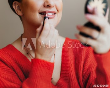 Putting on lipstick