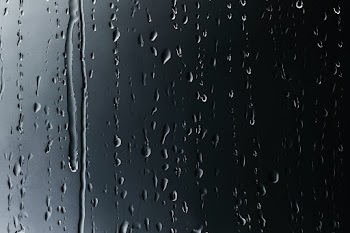 Rain drops on glass textured background