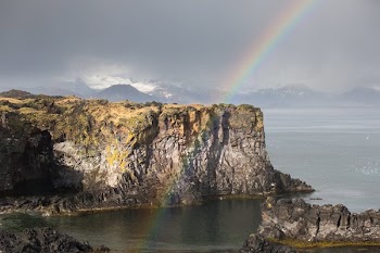 Rainbow And Rock Cliff