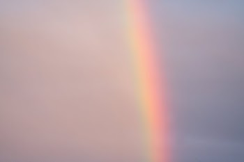 Rainbow on cloudless sly in nature