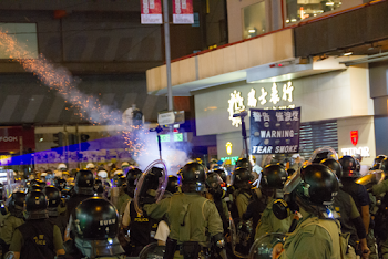 Rally In The Street With Soldiers Wearing Black Helmets 