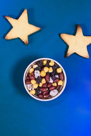 Ramadan Kareem background with traditional middle-eastern exotic dry date fruits, raisins, cookies and nuts. Holy Ramadan month magic