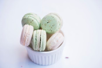 ramiken of macarons on white surface