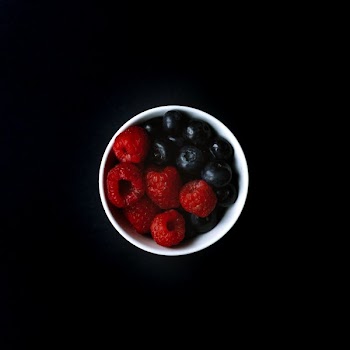 Raspberries And Blueberries In Dish
