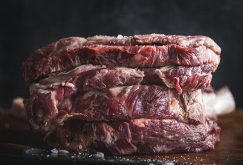 Raw Meat on Brown Wooden Surface