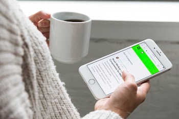 Reading Web Design Blog Hackernoon On Phone