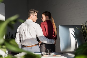 Rear View Managers Embracing Workplace Office Romance Concept