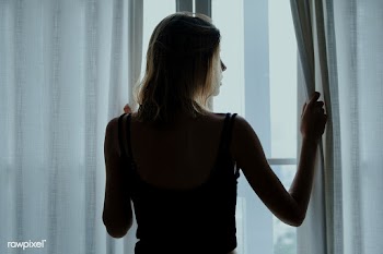 Rear view of a woman standing by the window | Free  photo - 2329349