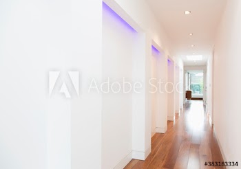 Recessed neon lighting in modern hallway