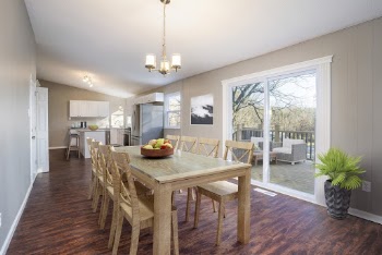 Rectangular Brown Wooden Table With Chairs Beside Wall