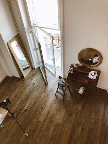 Rectangular Mirror Behind Opened Glass Door