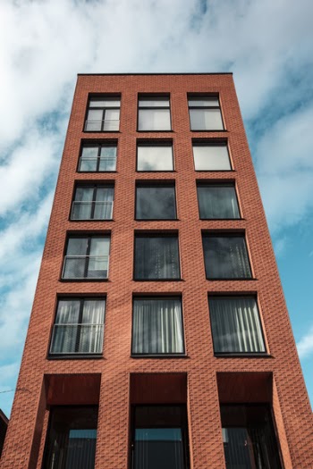Red and Black Concrete High-rise Building