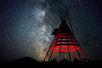 Red and Black Indian Hut Under Star Sky