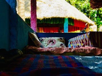 Red and Blue Blanket and Colorful Pillows